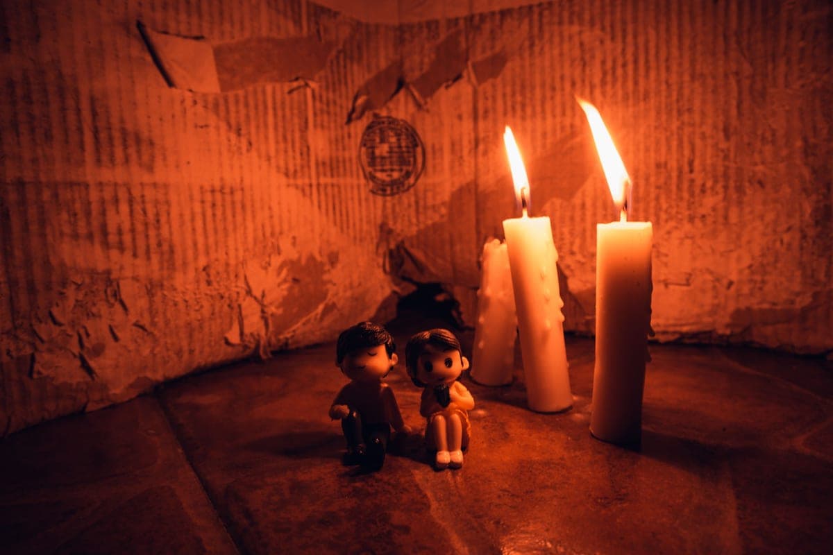 A dark room lit by a single small light source