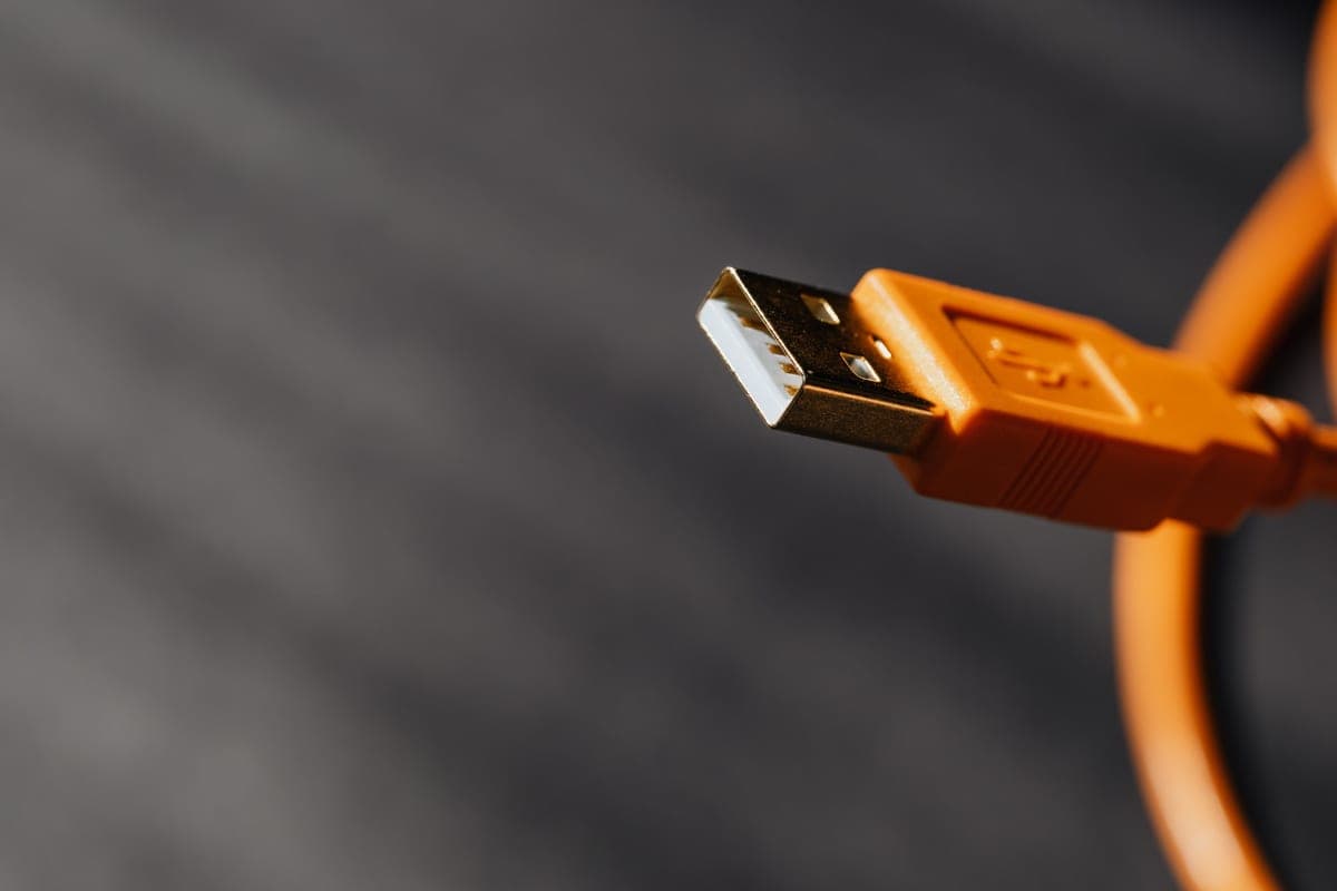 A USB-C cable connected to a device, close up