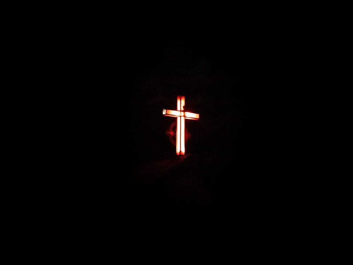 A dim red glow in darkness