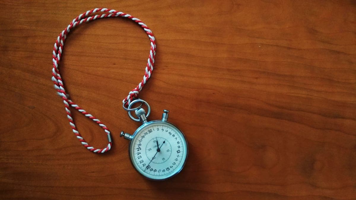 A stopwatch on a dark surface
